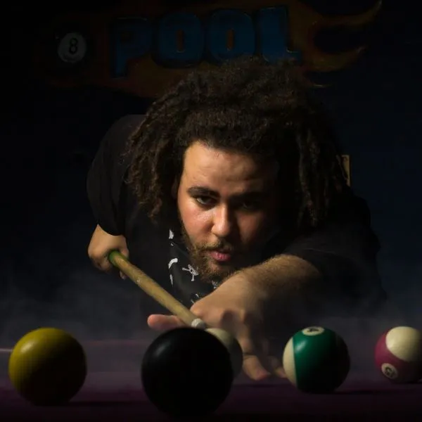 A man about to take a shot in a pool game