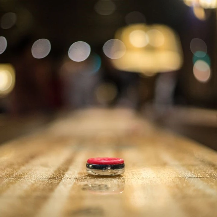 Shuffle puck on a Shuffleboard