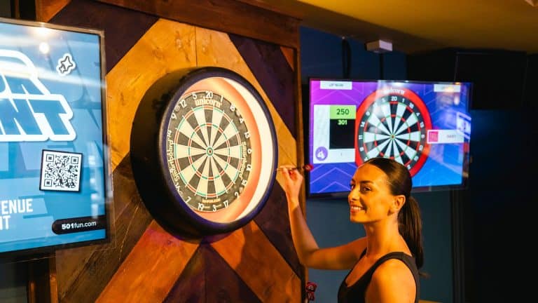 A women playing interactive darts at The Kelso Loughborough